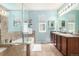 Light and airy bathroom with a soaking tub, separate shower, and double vanity at 1038 Mircos St, Erie, CO 80516