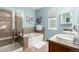 Light and airy bathroom with a soaking tub, separate shower, and double vanity at 1038 Mircos St, Erie, CO 80516