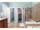 Bathroom featuring shower, vanity, and tile floor; plenty of storage at 1038 Mircos St, Erie, CO 80516