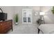 Bright bedroom with charming french doors, plenty of light, and neutral walls to bring a sense of peace at 1038 Mircos St, Erie, CO 80516