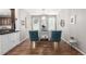 Elegant dining area with hardwood floors, stylish chairs, a decorative table, and lots of natural light at 1038 Mircos St, Erie, CO 80516