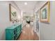 Warm and inviting foyer with hardwood floors, stylish decor, and an open view into the living spaces at 1038 Mircos St, Erie, CO 80516