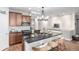 Kitchen with center island, seating, and updated appliances; great for entertaining at 1038 Mircos St, Erie, CO 80516