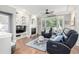 Cozy living room with built-in bookshelves, fireplace, and large windows for natural light at 1038 Mircos St, Erie, CO 80516