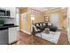 Inviting living room boasts hardwood floors, a comfortable sectional, and stylish decor at 1038 Mircos St, Erie, CO 80516