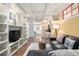 Cozy living room showcases built-in shelving, a comfortable seating area, and an open layout at 1038 Mircos St, Erie, CO 80516