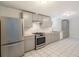 Modern kitchen with gray cabinets, stainless steel appliances and updated countertops at 1145 Rosemary St # 105, Denver, CO 80220