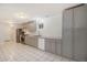 Updated kitchen with gray cabinets, stainless steel appliances, and durable tile flooring at 1145 Rosemary St # 105, Denver, CO 80220