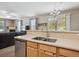 Open kitchen featuring stainless steel appliances and a seamless view into the living room area at 11259 S Cedar Gulch Ln # A, Parker, CO 80134