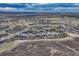Community aerial view featuring homes and scenic mountain views under an evening sky at 788 Alumroot St, Castle Rock, CO 80104