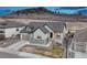 Aerial view of a two-story home with a well-manicured lawn and a two-car garage at 788 Alumroot St, Castle Rock, CO 80104