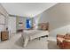 Neutral-toned bedroom includes a comfortable bed, natural light and cozy decor at 788 Alumroot St, Castle Rock, CO 80104