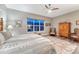 Comfortable bedroom with a window offering ample natural light, ceiling fan, and decor at 788 Alumroot St, Castle Rock, CO 80104