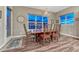 Dining area with hardwood floors, a rustic chandelier and large windows at 788 Alumroot St, Castle Rock, CO 80104