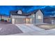 Home features a spacious three-car garage and manicured landscaping at 788 Alumroot St, Castle Rock, CO 80104