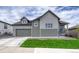 Charming two-story home featuring board and batten siding and a well-maintained lawn at 788 Alumroot St, Castle Rock, CO 80104