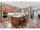 Bright kitchen with island seating, stainless appliances, and ample cabinet space at 788 Alumroot St, Castle Rock, CO 80104