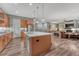 Open concept kitchen with a large center island, hardwood floors, and stainless appliances at 788 Alumroot St, Castle Rock, CO 80104