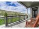 Covered patio space with chairs overlooking green space and blue sky at 788 Alumroot St, Castle Rock, CO 80104