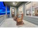 Covered front porch with wooden rocking chairs at 788 Alumroot St, Castle Rock, CO 80104