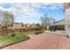 Spacious backyard features a brick patio, grass, and a wooden fence creating a private retreat at 19707 E Princeton Pl, Aurora, CO 80013