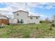 Backyard featuring a lawn and a partial view of the home's exterior at 19707 E Princeton Pl, Aurora, CO 80013