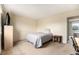 Cozy bedroom with twin bed, bedside table, and neutral carpet at 19707 E Princeton Pl, Aurora, CO 80013