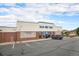 Commercial building featuring ample parking, brick accents, and prominent signage at 19707 E Princeton Pl, Aurora, CO 80013