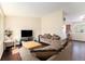 Bright living room with hardwood floors, sofa, and large window with natural light at 19707 E Princeton Pl, Aurora, CO 80013