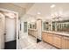 Spacious bathroom with double sinks, vanity, tile floor and glass enclosed shower at 1551 Larimer St # 1402, Denver, CO 80202