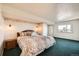 Spacious bedroom featuring a comfortable bed, city views and ensuite bath at 1551 Larimer St # 1402, Denver, CO 80202