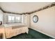 Bedroom with a quaint bed, city views from window, and ensuite bath at 1551 Larimer St # 1402, Denver, CO 80202