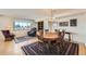 Cozy dining area with hardwood floors, area rug, city view, and classic furnishings at 1551 Larimer St # 1402, Denver, CO 80202