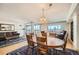 Bright open concept living and dining area with city view in background and hardwood flooring at 1551 Larimer St # 1402, Denver, CO 80202