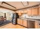 Well-equipped kitchen with modern appliances and breakfast nook for casual dining and hardwood flooring at 1551 Larimer St # 1402, Denver, CO 80202