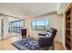 Bright and airy living room with large window offering panoramic city views and comfortable seating at 1551 Larimer St # 1402, Denver, CO 80202