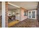 Living room featuring hardwood floors and French doors to the sunroom at 1551 Larimer St # 1402, Denver, CO 80202