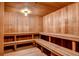 Relaxing home sauna features wood paneled walls, ceiling and multiple benches at 1551 Larimer St # 1402, Denver, CO 80202