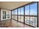 Sunroom featuring floor-to-ceiling windows with city and mountain views at 1551 Larimer St # 1402, Denver, CO 80202