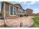 Stamped concrete patio featuring outdoor seating and a gas grill, great for outdoor living at 2043 S Cathay Way, Aurora, CO 80013