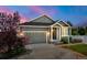 Charming single-Gathering home with manicured lawn, covered porch, and attached two car garage at 2043 S Cathay Way, Aurora, CO 80013