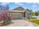 A well-kept single-Gathering home boasting a two-car garage, inviting entrance, and lush front yard at 2043 S Cathay Way, Aurora, CO 80013