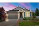 Charming single-Gathering home featuring a well-maintained lawn, attached garage and inviting entrance at 2043 S Cathay Way, Aurora, CO 80013
