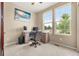Bright office space with desk setup, comfortable chair, and natural light at 2043 S Cathay Way, Aurora, CO 80013