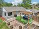 Aerial view of a charming backyard with outdoor dining, fire pit, and garden at 9630 W 38Th Ave, Wheat Ridge, CO 80033