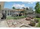 Enjoy the backyard with a patio seating area, fire pit, and a well-manicured lawn for entertaining and outdoor enjoyment at 9630 W 38Th Ave, Wheat Ridge, CO 80033