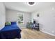 Bedroom features a desk, hardwood floors, and a window with natural light at 9630 W 38Th Ave, Wheat Ridge, CO 80033