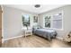 Well-lit bedroom with wood floors, two windows, and comfortable furnishings for a relaxing space at 9630 W 38Th Ave, Wheat Ridge, CO 80033