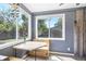 Bright dining area with large windows offering natural light and backyard views, complemented by cozy seating at 9630 W 38Th Ave, Wheat Ridge, CO 80033