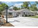 Charming gray home featuring a basketball hoop and a spacious concrete driveway perfect for outdoor activities at 9630 W 38Th Ave, Wheat Ridge, CO 80033